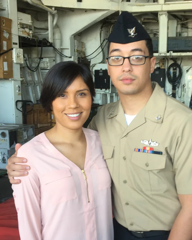 Geoff Bey in his Navy service uniform with his wife aboard ship in 2017.